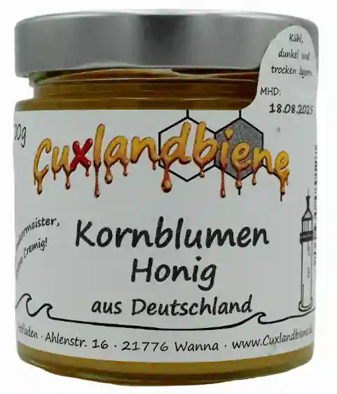 Kornblumenhonig Glas mit Etikett flüssig